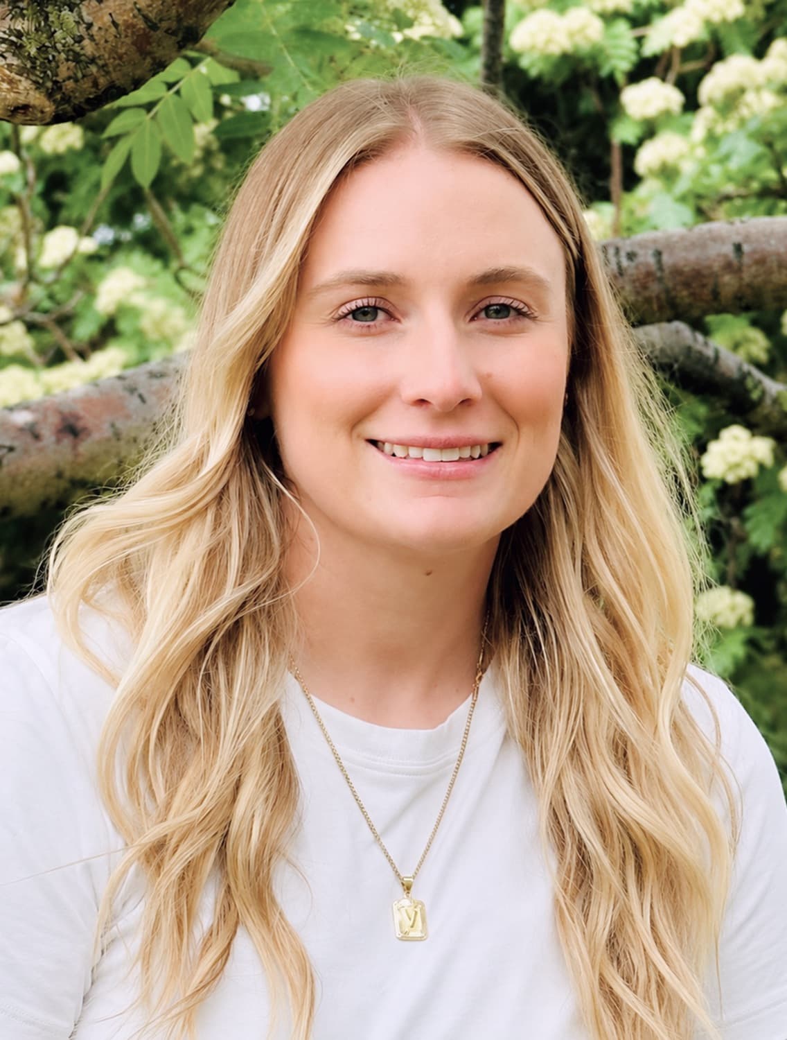 Vanessa Rankin, R. Psych. — a warm outdoor portrait among spring greenery
